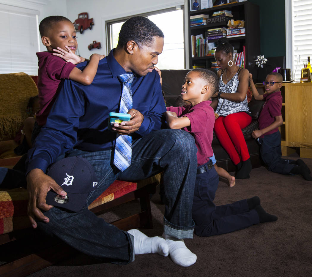 Deon Derrico sits with his children, Deniko, 4, left, and Denver, 6, at their home in North Las Vegas on Wednesday, Aug. 15, 2018. Chase Stevens Las Vegas Review-Journal @csstevensphoto