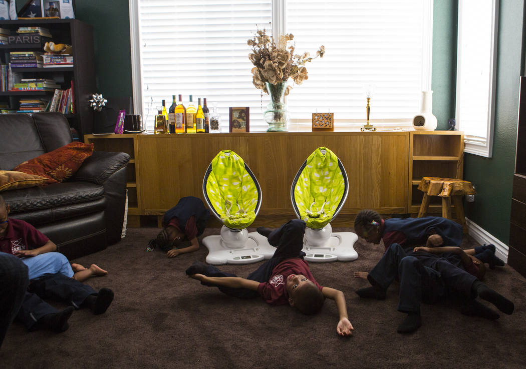 Some of the 11 Derrico children relax at home in North Las Vegas on Wednesday, Aug. 15, 2018. Chase Stevens Las Vegas Review-Journal @csstevensphoto