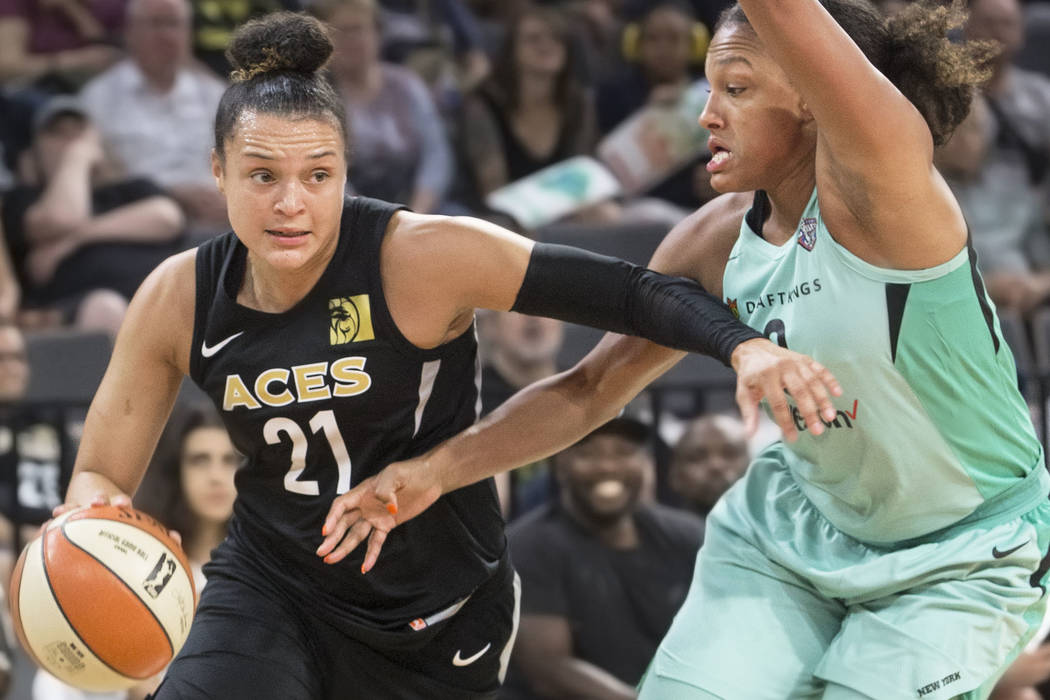 Aces guard Kayla McBride (21) drives baseline past New York Liberty guard Marissa Coleman (0) in the fourth quarter on Wednesday, Aug. 15, 2018, at the Mandalay Bay Events Center, in Las Vegas. Be ...