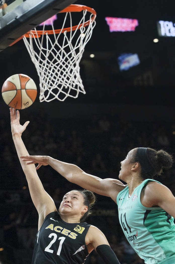 Aces guard Kayla McBride (21) drives past New York Liberty guard Kiah Stokes (41) in the fourth quarter on Wednesday, Aug. 15, 2018, at the Mandalay Bay Events Center, in Las Vegas. Benjamin Hager ...