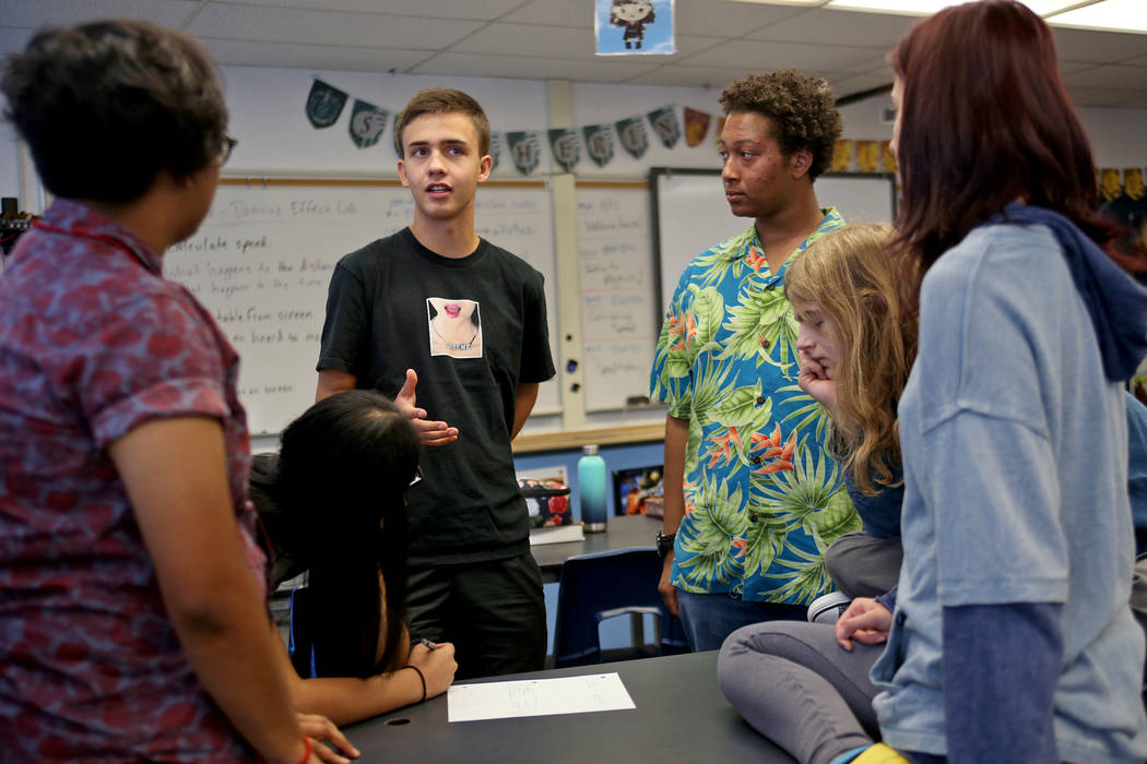 Michelle Garcia, 16, from left, Angely Salazar, 16, Raphael Moll, 16, Jayden Davis, 17, Dash Chrisman, 17, and Emma-Nikole Georgiev, 17, brainstorm ideas for videos to inform people about the robo ...