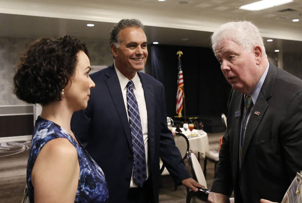 Danny Tarkanian, Republican candidate for the 3rd Congressional District, second left, and his wife Amy, left, chat with John Hambrick, State Assembly District 2, during the Women's Chamber 2018 c ...