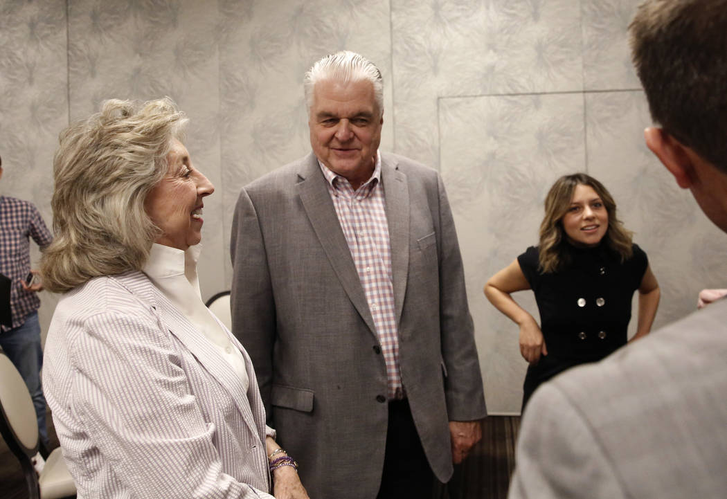 Dina Titus, Democratic candidate for the 1st Congressional District, left, and Democratic gubernatorial candidate Steve Sisolak chat during the Women's Chamber 2018 candidate forum luncheon event ...