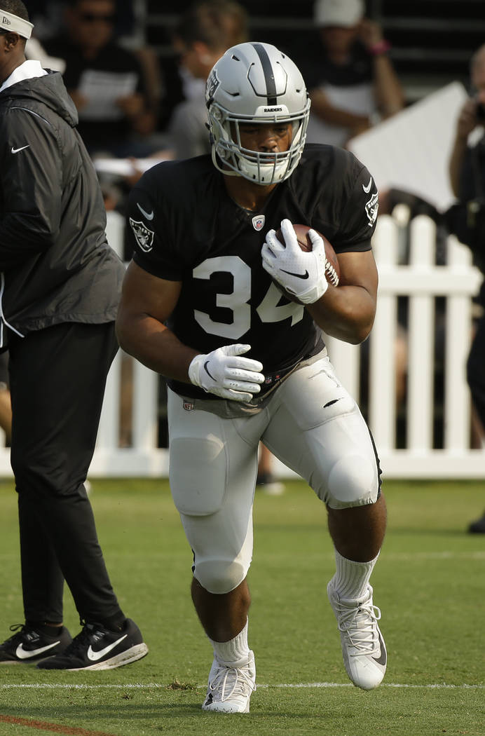 Oakland Raiders running back Chris Warren during NFL football practice Tuesday, Aug. 7, 2018, in Napa, Calif. Both the Oakland Raiders and the Detroit Lions held a joint practice before their upco ...