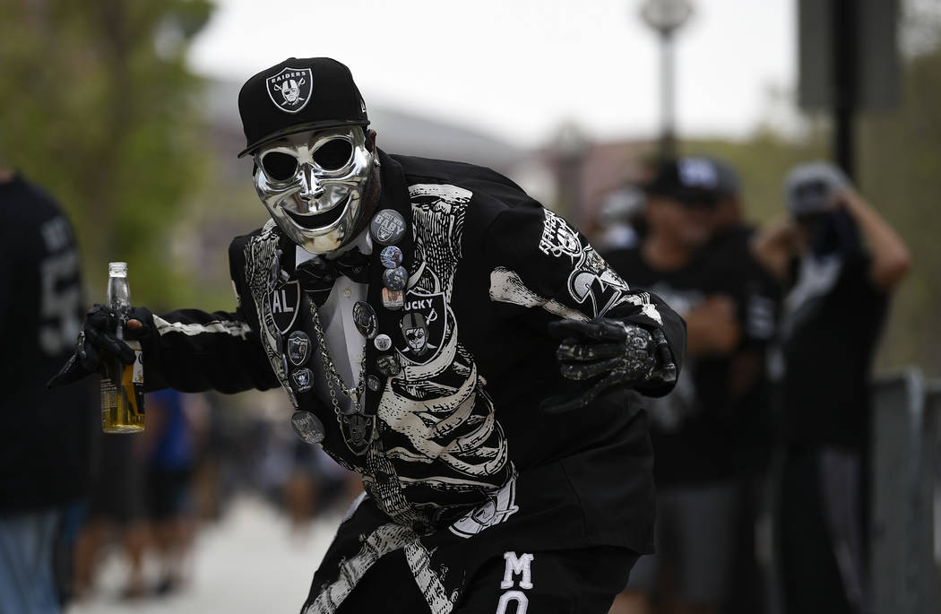 A Oakland Raider fan poses before an NFL preseason football game against the Los Angeles Rams Saturday, Aug. 18, 2018, in Los Angeles. (AP Photo/Kelvin Kuo)