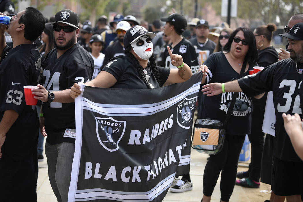 A Oakland Raider fan poses before an NFL preseason football game against the Los Angeles Rams Saturday, Aug. 18, 2018, in Los Angeles. (AP Photo/Kelvin Kuo)