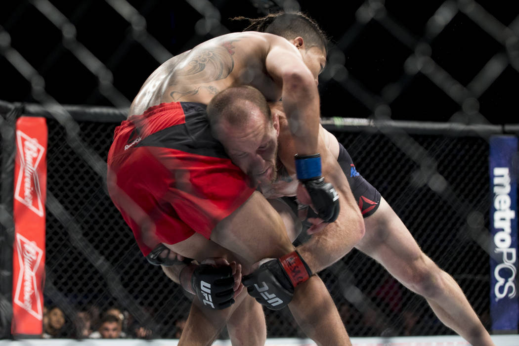 Gray Maynard, right, takes down Teruto Ishihara during the The Ultimate Fighter 25 featherweight bout at T-Mobile Arena in Las Vegas, Friday, July 7, 2017. Maynard won by unanimous decision. Erik ...