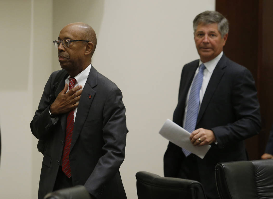 Ohio State University president Dr. Michael Drake, left, and university board of trustees chair Michael Gasser leave to go into executive session during a meeting of the trustees to discuss the fu ...