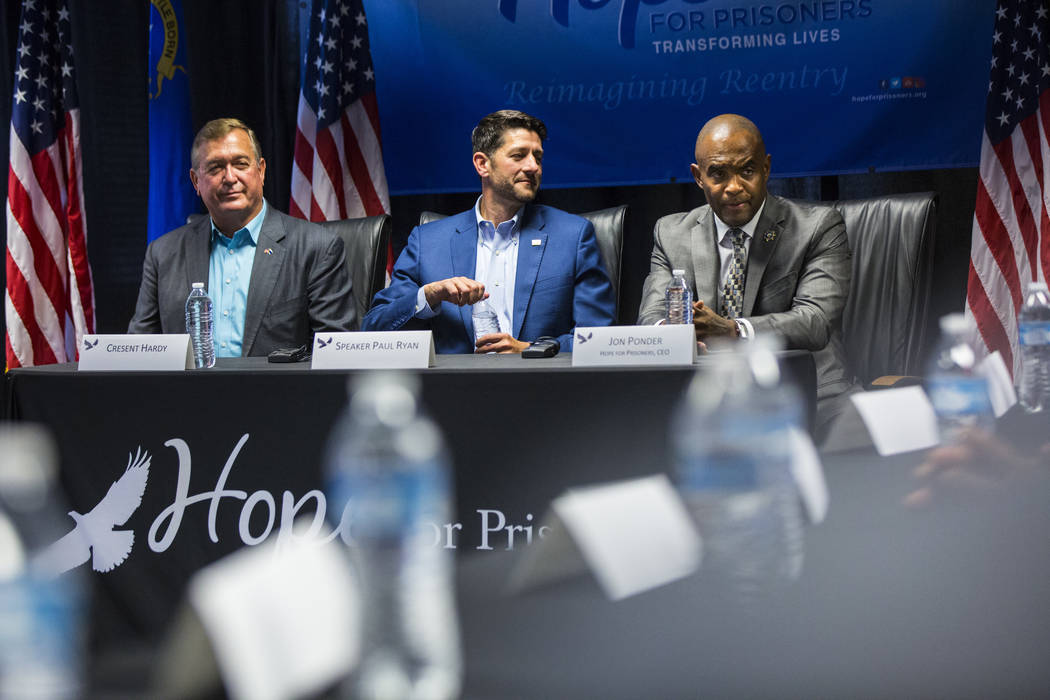 Hope for Prisoners CEO Jon Ponder, right, speaks alongside former U.S. Rep. Cresent Hardy, left, and House Speaker Paul Ryan, R-Wis., during a roundtable discussion at Hope for Prisoners in Las Ve ...