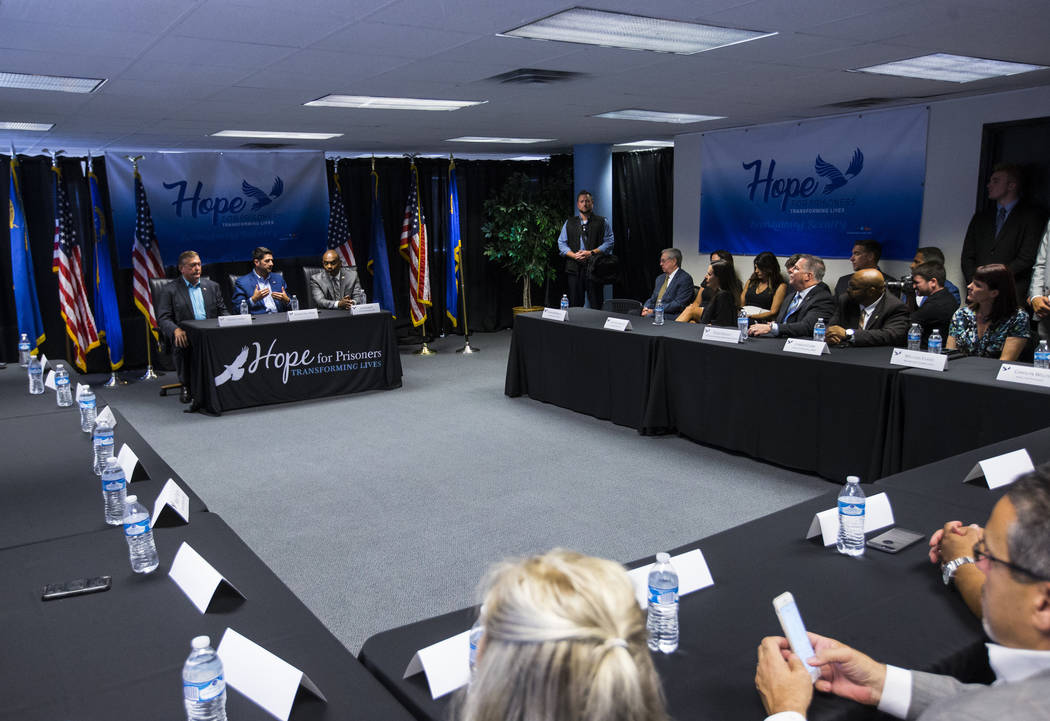 House Speaker Paul Ryan, R-Wis., center left, speaks as former U.S. Rep. Cresent Hardy, left, and Hope for Prisoners CEO Jon Ponder look on during a roundtable discussion at Hope for Prisoners in ...
