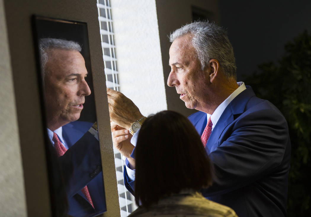 Clark County District Attorney Steve Wolfson is reflected in a frame before the start of a roundtable discussion at Hope for Prisoners in Las Vegas on Wednesday, Aug. 22, 2018. Chase Stevens Las V ...