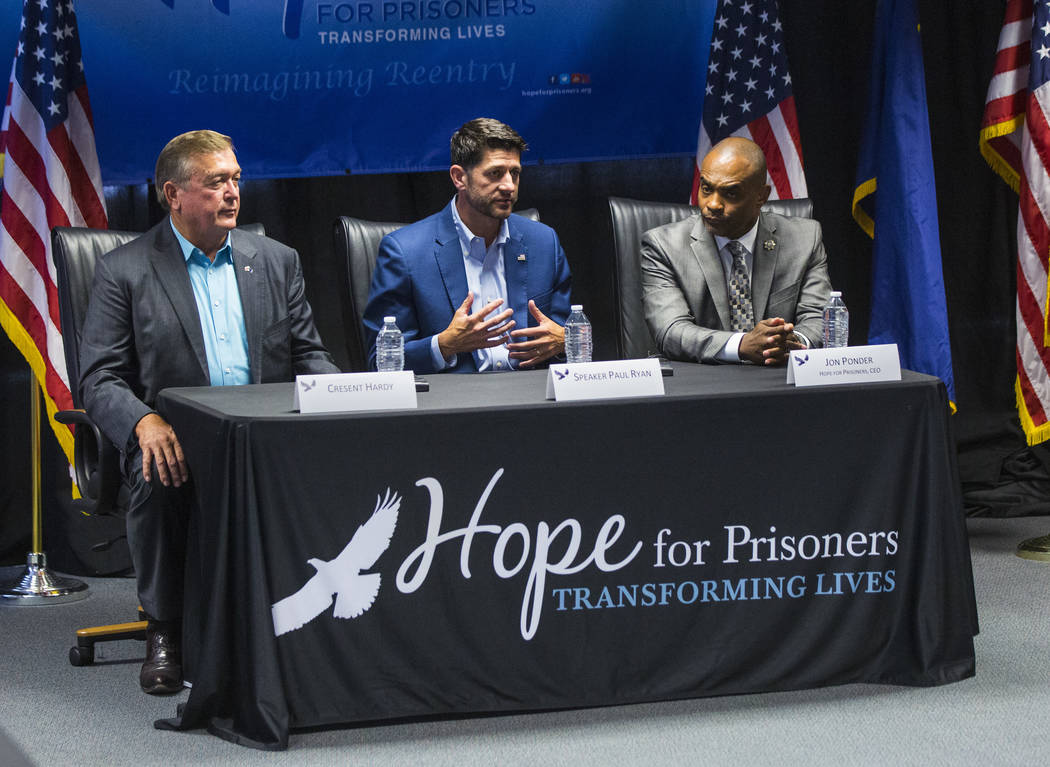 House Speaker Paul Ryan, R-Wis., center, speaks as former U.S. Rep. Cresent Hardy, left, and Hope for Prisoners CEO Jon Ponder look on during a roundtable discussion at Hope for Prisoners in Las V ...