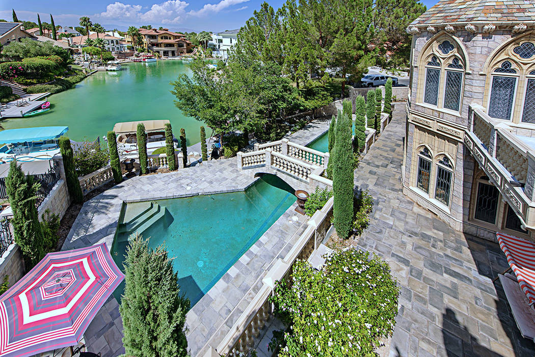 The 11,662-square-foot castle is on The Lakes and has a boat dock. (Rob Jensen Co.)