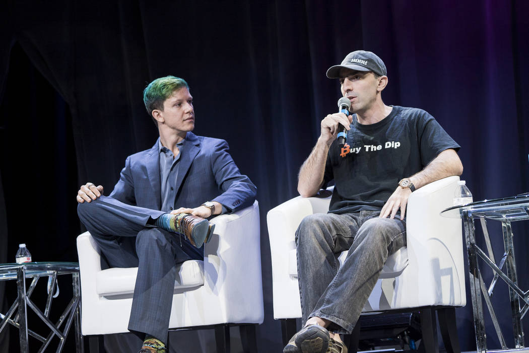 William Chartain, head of sales at BitWage and Startups, left, and Tone Vays, ex-Wall Street professional, speak on a panel at Block Show at The Venetian in Las Vegas, Tuesday, Aug. 21, 2018. (Mar ...