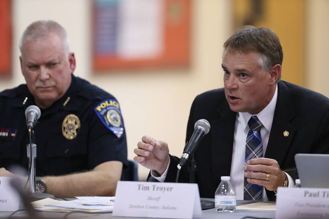 Steuben County, Indiana, Sheriff Tim Troyer, right, speaks during a Federal Commission on School Safety Listening Session at the Miley Achievement Center in Las Vegas, with CCSD Chief of Police Ja ...