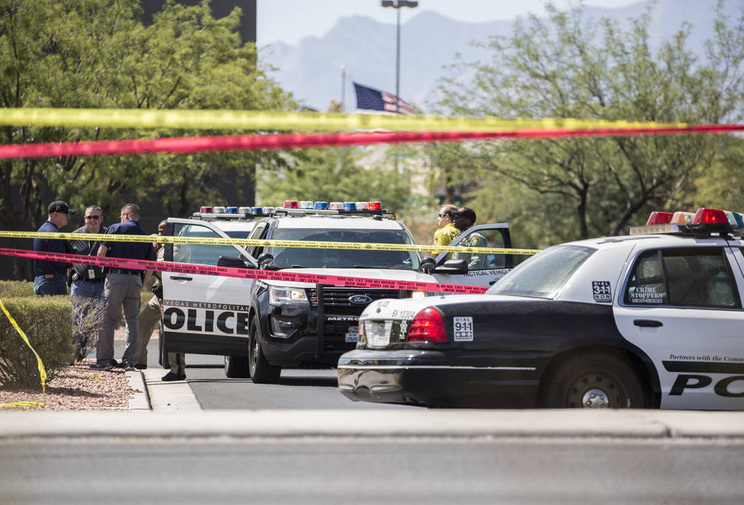 The Metropolitan Police Department investigates an officer involved shooting near Spring Mountain Road and Rainbow Boulevard on Friday, Aug. 24, 2018, in Las Vegas. Benjamin Hager Las Vegas Review ...