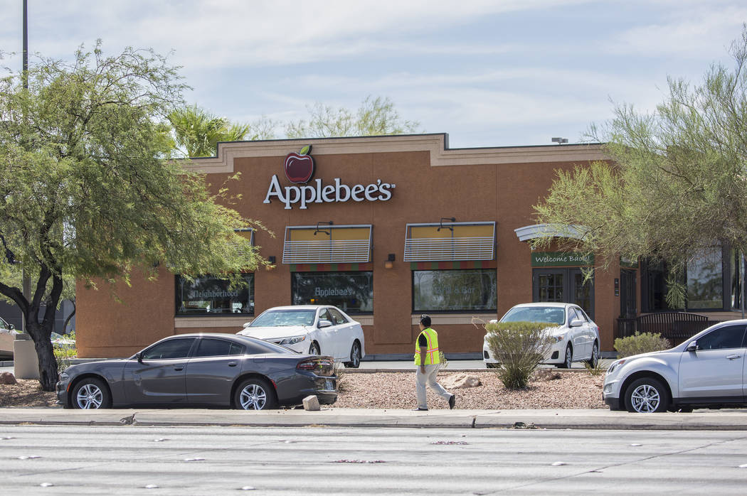 The Metropolitan Police Department investigates an officer involved shooting near Spring Mountain Road and Rainbow Boulevard on Friday, Aug. 24, 2018, in Las Vegas. Benjamin Hager Las Vegas Review ...
