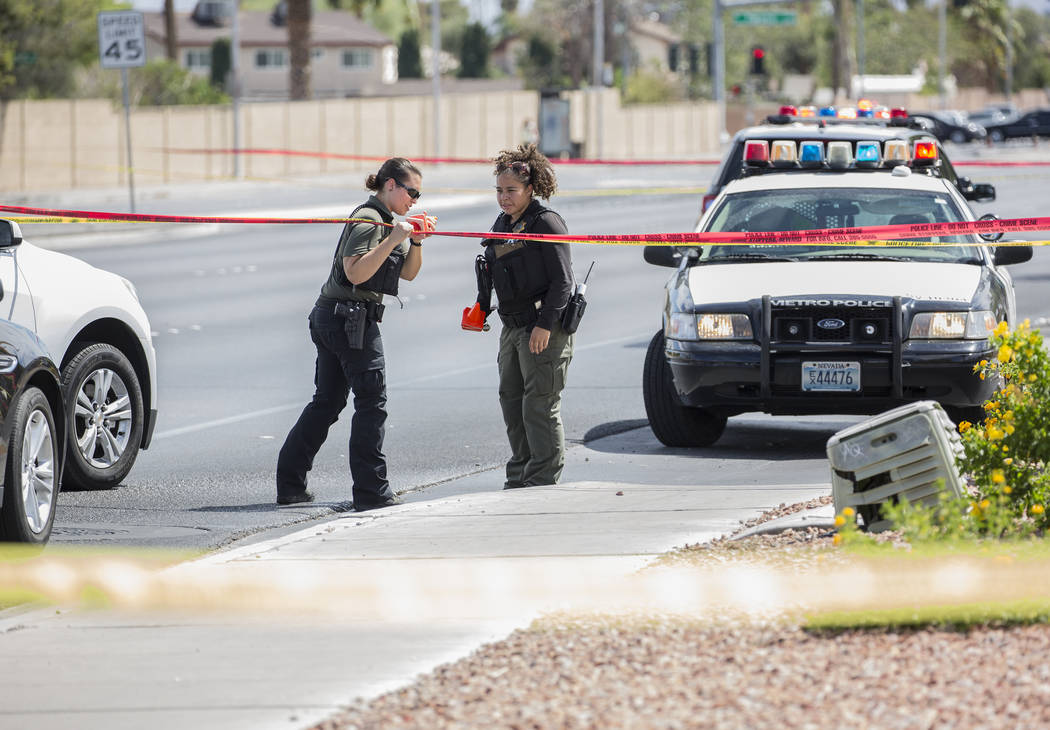 The Metropolitan Police Department investigates an officer involved shooting near Spring Mountain Road and Rainbow Boulevard on Friday, Aug. 24, 2018, in Las Vegas. Benjamin Hager Las Vegas Review ...
