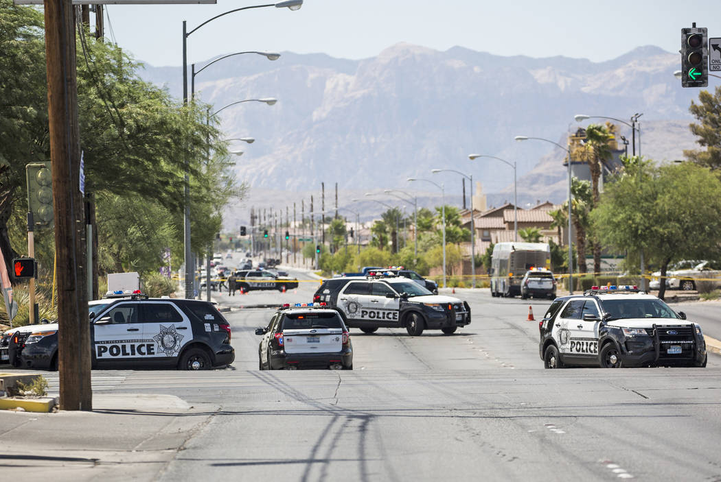 The Metropolitan Police Department investigates an officer involved shooting near Spring Mountain Road and Rainbow Boulevard on Friday, Aug. 24, 2018, in Las Vegas. Benjamin Hager Las Vegas Review ...
