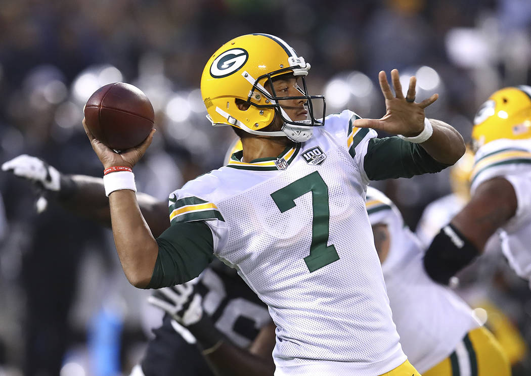 Green Bay Packers quarterback Brett Hundley (7) throws a pass against the Oakland Raiders during the first half of an NFL preseason football game in Oakland, Calif., Friday, Aug. 24, 2018. (AP Pho ...