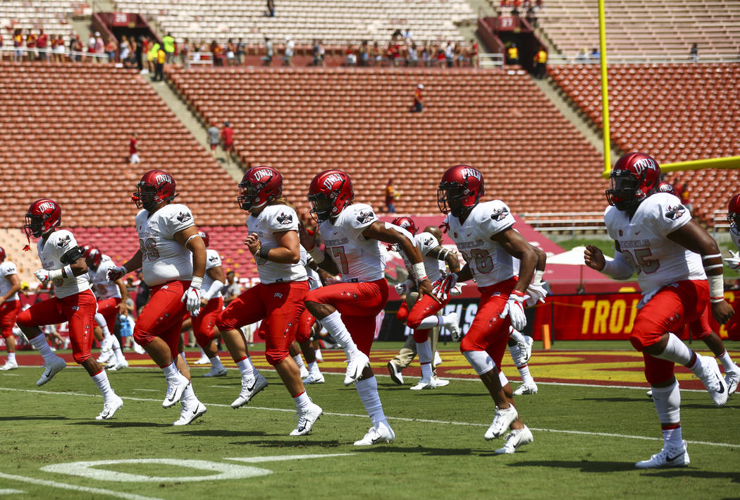 UNLV Rebels players practice before the start of a football game against the USC Trojans at the Los Angeles Memorial Coliseum in Los Angeles on Saturday, Sept. 1, 2018. Chase Stevens Las Vegas Rev ...