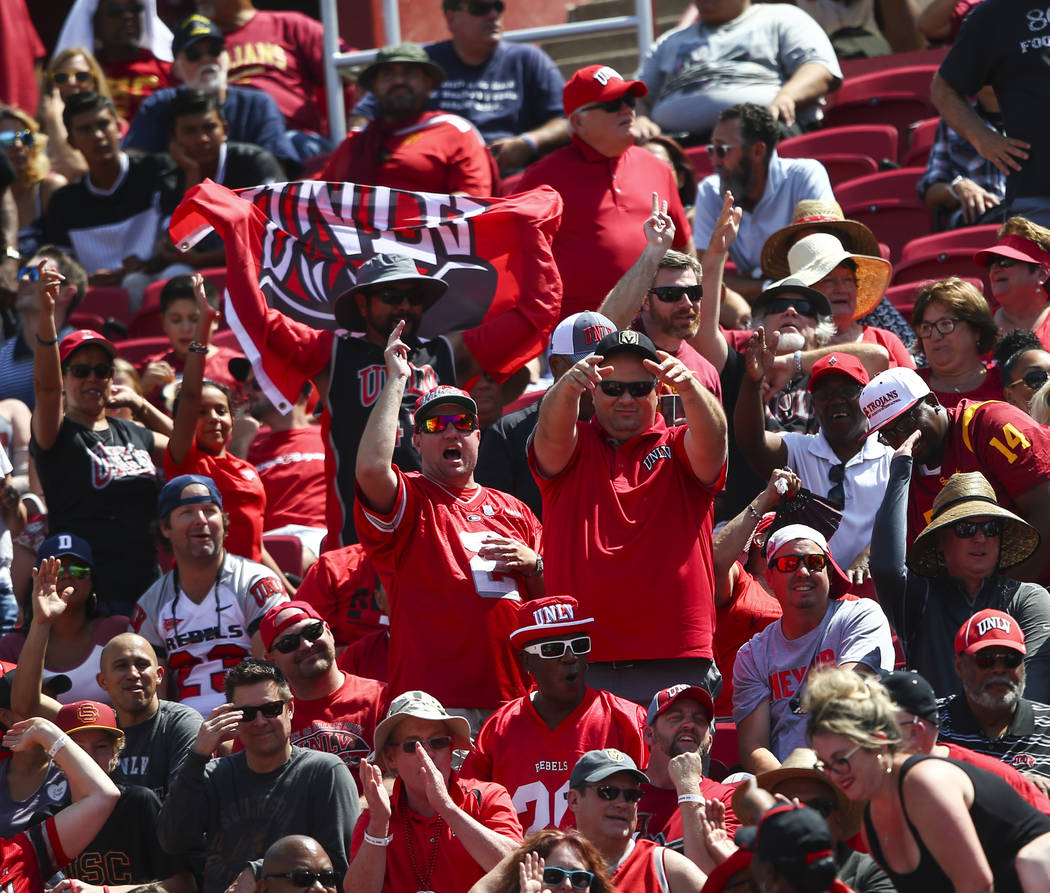UNLV Rebels fans celebrate a touchdown against the USC Trojans during the first half of a football game at the Los Angeles Memorial Coliseum in Los Angeles on Saturday, Sept. 1, 2018. Chase Steven ...