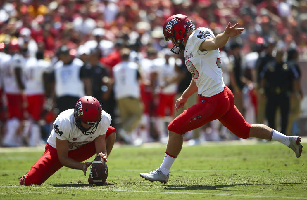 UNLV Rebels place kicker Evan Pantels (30) kicks the ball to score against the USC Trojans during the first half of a football game at the Los Angeles Memorial Coliseum in Los Angeles on Saturday, ...
