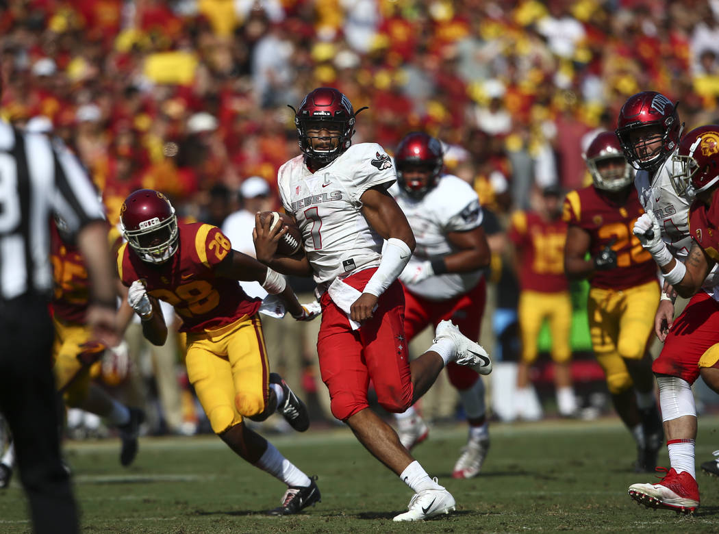 UNLV Rebels quarterback Armani Rogers (1) runs the ball against the USC Trojans during the second half of a football game at the Los Angeles Memorial Coliseum in Los Angeles on Saturday, Sept. 1, ...