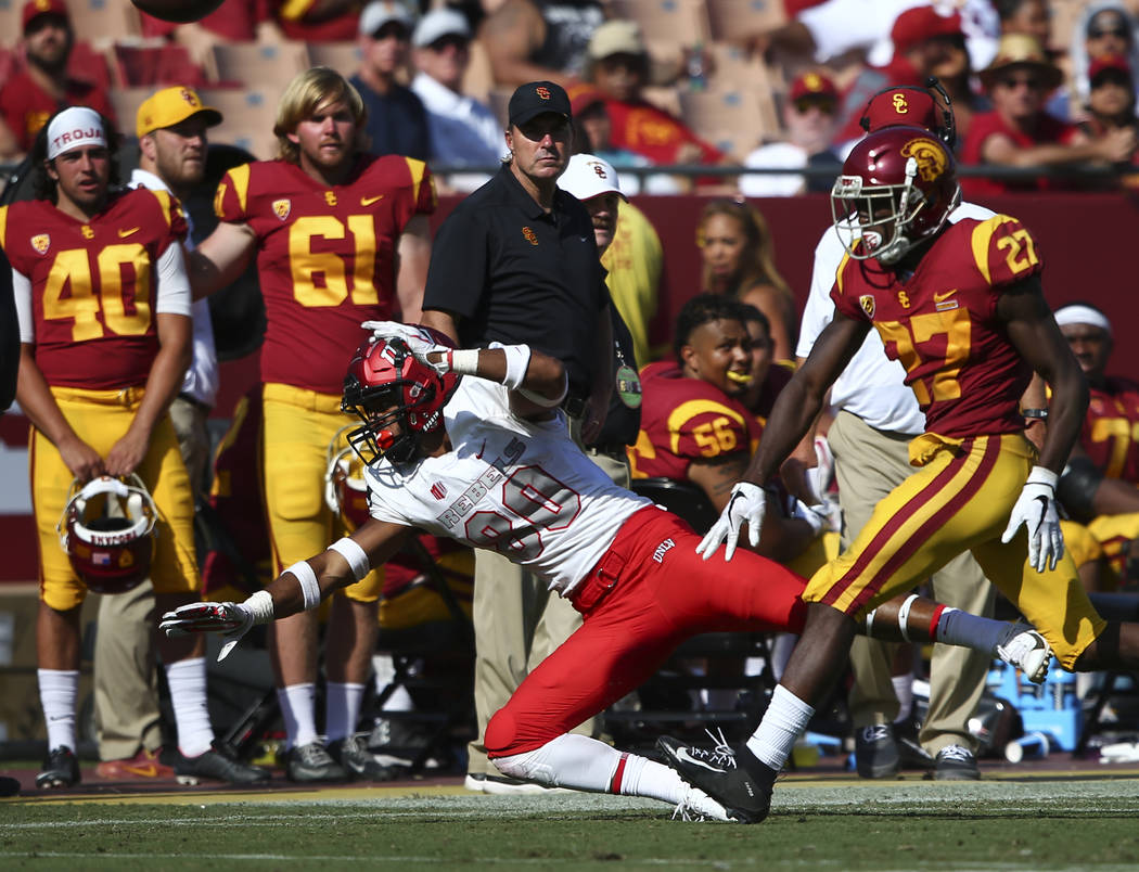 USC Trojans cornerback Ajene Harris (27) breaks up a pass intended for UNLV Rebels wide receiver Brandon Presley (80) during the second half of a football game at the Los Angeles Memorial Coliseum ...