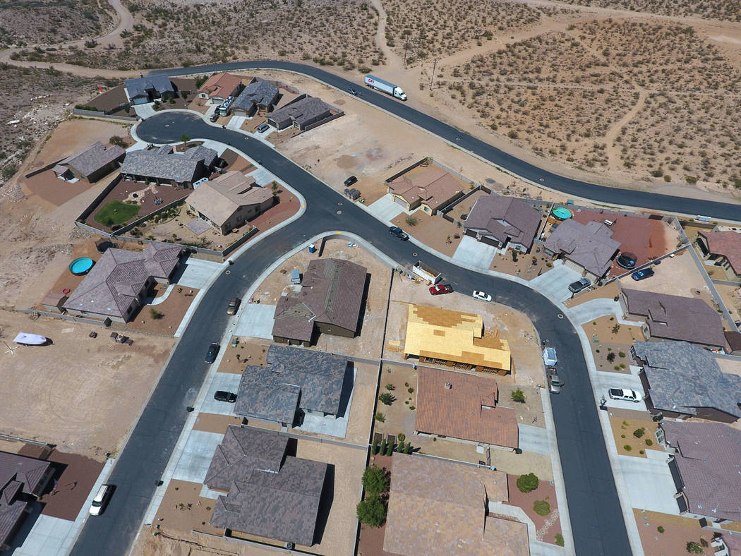 Aerial view of several new homes in different stages of construction in a subdivision off Slaughter House Canyon Road in Kingman, Ariz. on Friday, August 17, 2018. Michael Quine Las Vegas Review-J ...