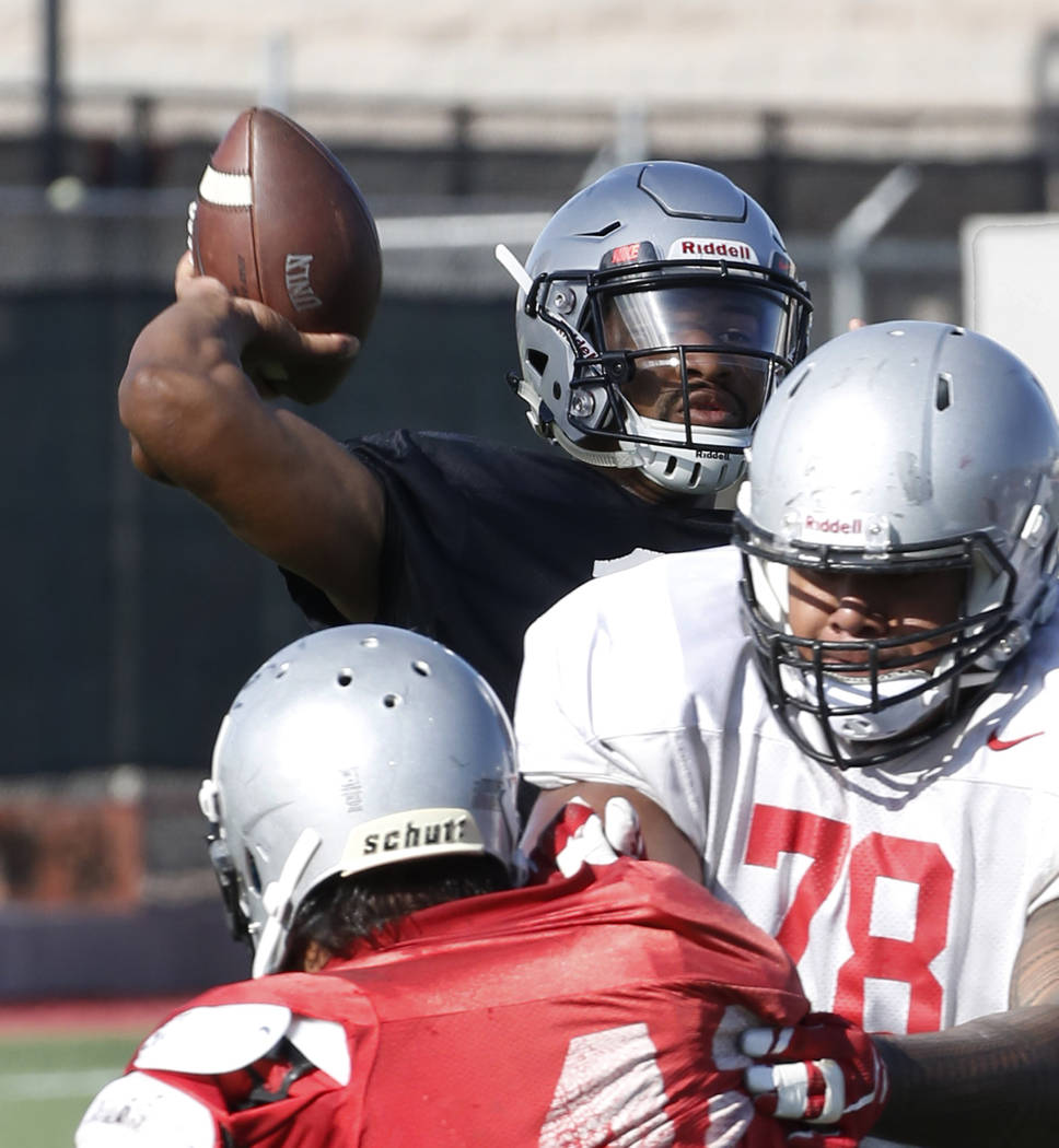 UNLV offensive line Justin Polu (78) defends as quarterback Armani Rogers, left, throws pass during team practice on Wednesday, Sept. 5, 2018, in Las Vegas. (Bizuayehu Tesfaye/Las Vegas Review-Jou ...