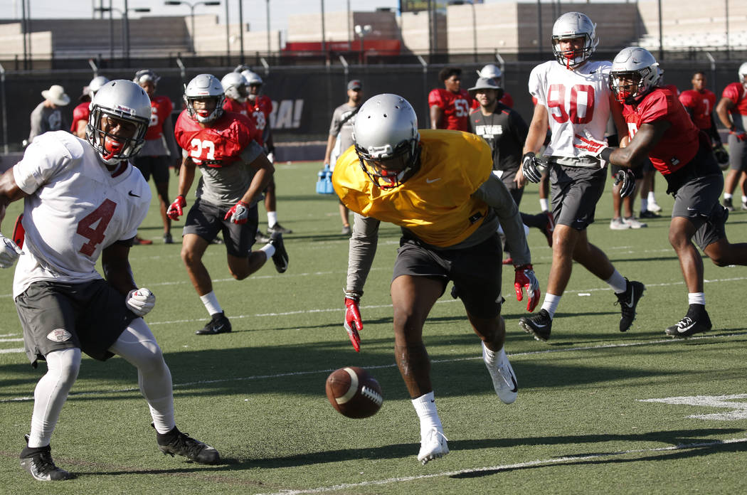 UNLV cornerback Alex Perry, right, tries to recover a loose ball during team practice on Wednesday, Sept. 5, 2018, in Las Vegas. (Bizuayehu Tesfaye/Las Vegas Review-Journal) @bizutesfaye