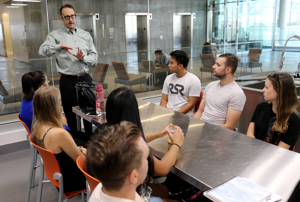 Todd Uglow, top, teaches Special Events Management class in the Marriott Executive Kitchen in Hospitality Hall at UNLV Thursday, Aug. 30, 2018. K.M. Cannon Las Vegas Review-Journal @KMCannonPhoto