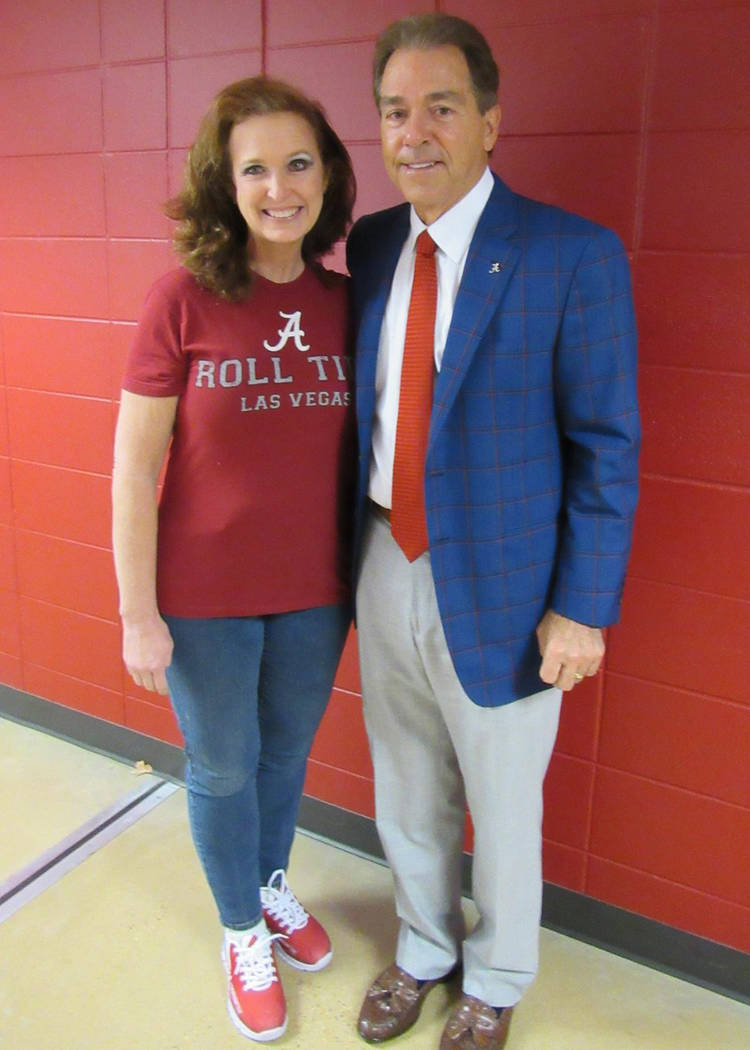 Cancer survivor Janet King poses with University of Alabama football coach Nick Saban. Courtesy of Janet King.