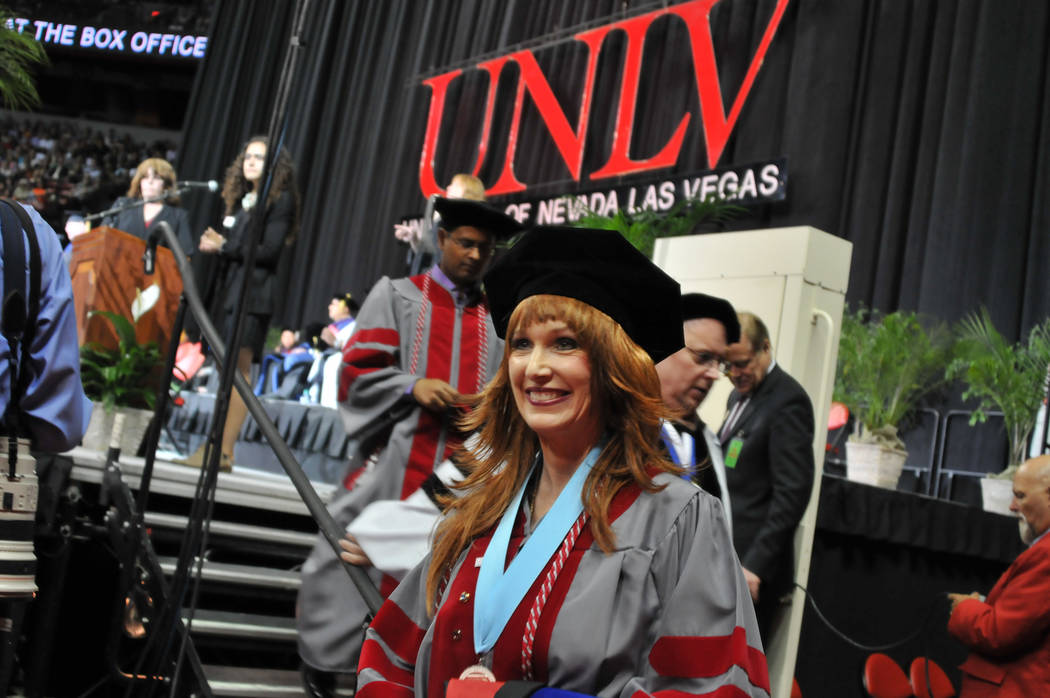 Janet King, 54, exits the stage May 13, 2017, at UNLV's spring commencement ceremony at the Thomas & Mack Center. (Jeff Mosier/View)