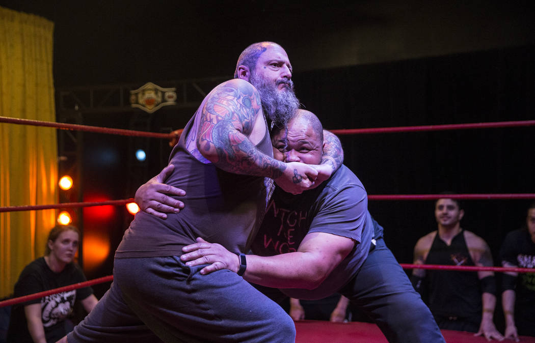 Former pro wrestlers Sinn Bodhi, left, and D. Lo Brown demonstrate a move to students at The Snake Pit Pro Wrestling Academy on Tuesday, March 6, 2018, in Las Vegas. Benjamin Hager Las Vegas Revie ...