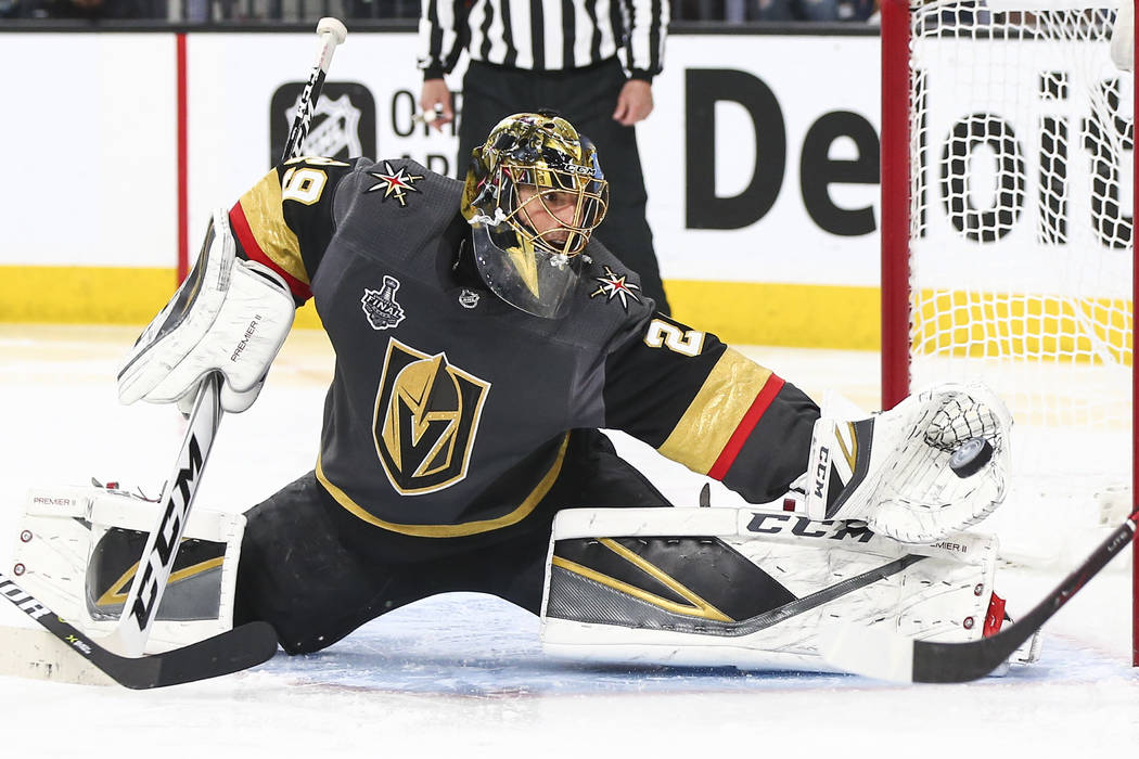 Golden Knights goaltender Marc-Andre Fleury (29) blocks a shot from Washington Capitals center Evgeny Kuznetsov, not pictured, during the second period of Game 5 of the Stanley Cup Final at T-Mobi ...