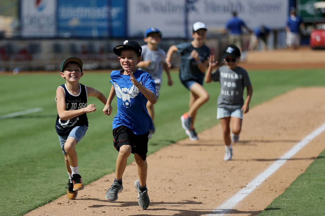 Las Vegas 51s fans run the bases after the final game ever at Cashman Field in Las Vegas Monday, Sept. 3, 2018. The team will move to a new stadium in Summerlin next season. K.M. Cannon Las Vegas ...