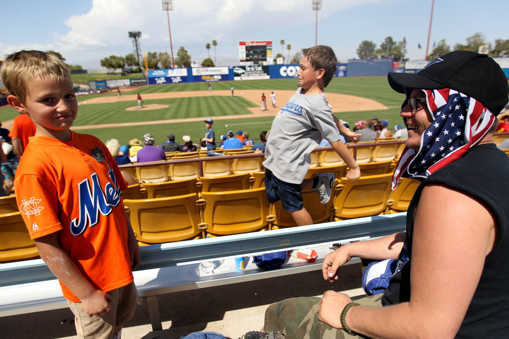 Clint Adams, right, with his sons Liam Adams, 8, left, and Shawn Adams, 11, during the Las Vegas 51s final game ever at Cashman Field in Las Vegas Monday, Sept. 3, 2018. The team will move to a ne ...