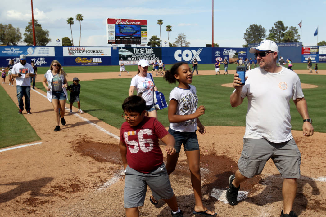 Las Vegas 51s fans run the bases after the final game ever at Cashman Field in Las Vegas Monday, Sept. 3, 2018. The team will move to a new stadium in Summerlin next season. K.M. Cannon Las Vegas ...