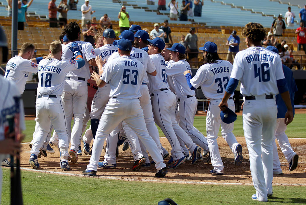 Las Vegas players mob Peter Alonso after his walk-off two-run home run during the final 51s game ever at Cashman Field in Las Vegas Monday, Sept. 3, 2018. (K.M. Cannon Las Vegas Review-Journal @KM ...