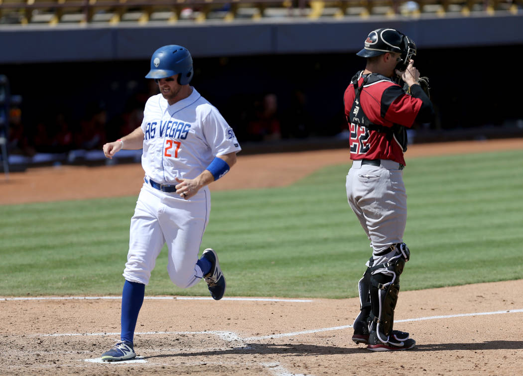 Las Vegas left fielder Patrick Kivlehan scores as Sacramento catcher Ronnie Freeman waits for the throw during the final 51s game ever at Cashman Field in Las Vegas Monday, Sept. 3, 2018. Las Vega ...