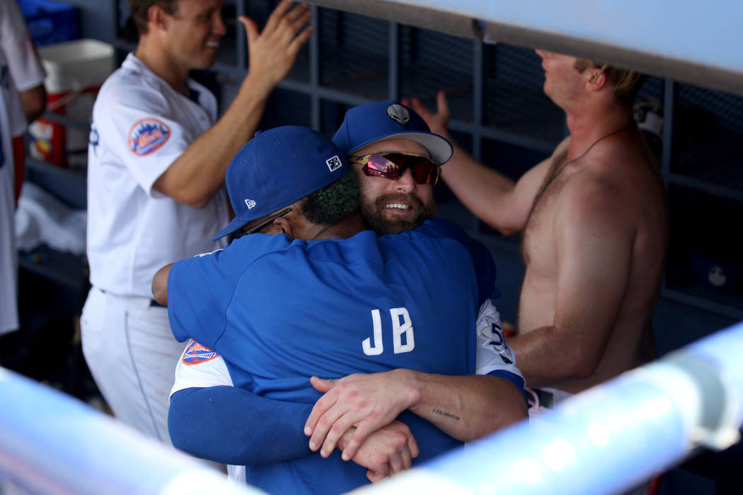 Las Vegas right fielder Bryce Brentz hugs a staff member after the final 51s game ever at Cashman Field in Las Vegas Monday, Sept. 3, 2018. Las Vegas beat Sacramento 4-3. The team will move to a n ...