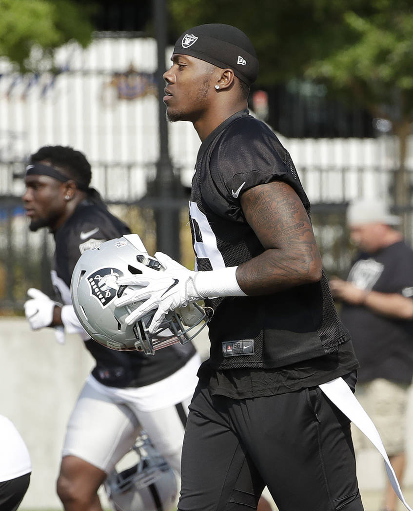 Oakland Raiders' Arden Key jogs on the field during NFL football practice in Napa, Calif., Saturday, July 28, 2018. (AP Photo/Jeff Chiu)
