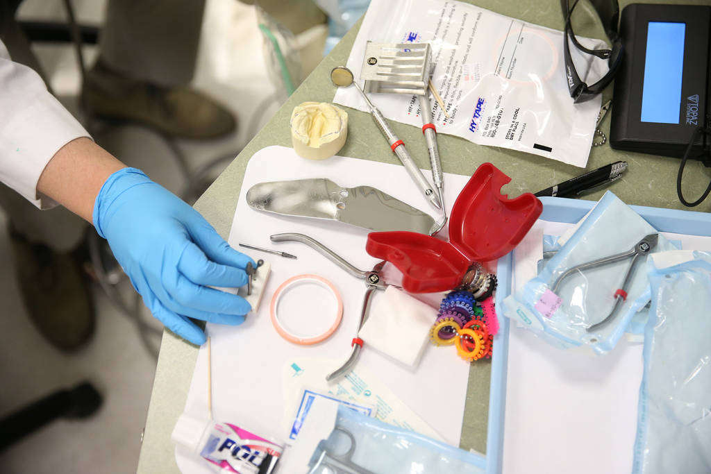 The working station of Dr. Glen Roberson, an orthodontist at the Orthodontic Clinic at Roseman University, in the process of adjusting the nasoalveolar molding (NAM) of Blake Muschong, a 10-week-o ...