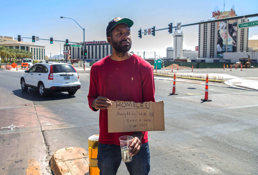 Licensed mental health therapist Sheldon Jacobs, posing as a homeless man, panhandles near South Grand Parkway and North City Parkway on Saturday, Sept. 1, 2018, in Las Vegas. Benjamin Hager Las V ...