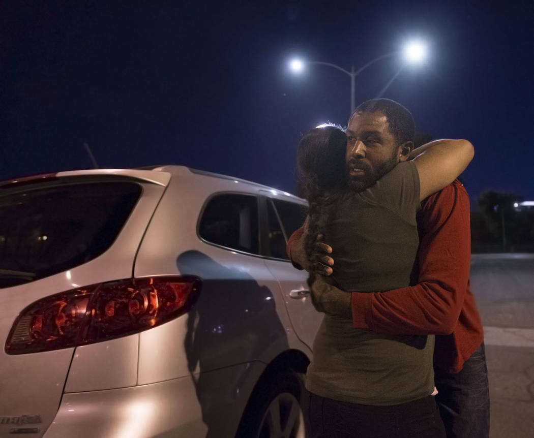 Licensed mental health therapist Sheldon Jacobs, right, hugs his wife Nicole before hitting the streets posing as a homeless man on Friday, Aug. 31, 2018, at Ethel Pearson Park, in Las Vegas.