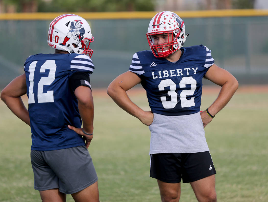 Liberty safety Austin Fiaseu, 12, and linebacker Kyle Beaudry, 32 during practice at the school in Las Vegas Wednesday, Sept. 5, 2018. K.M. Cannon Las Vegas Review-Journal @KMCannonPhoto