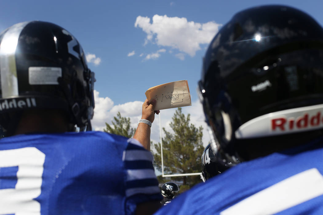 Desert Pines High School Coach Tico Rodriguez holds a play for the team practice at Desert Pines High School in Las Vegas, Wednesday, Sept. 5, 2018. Rachel Aston Las Vegas Review-Journal @rookie__rae