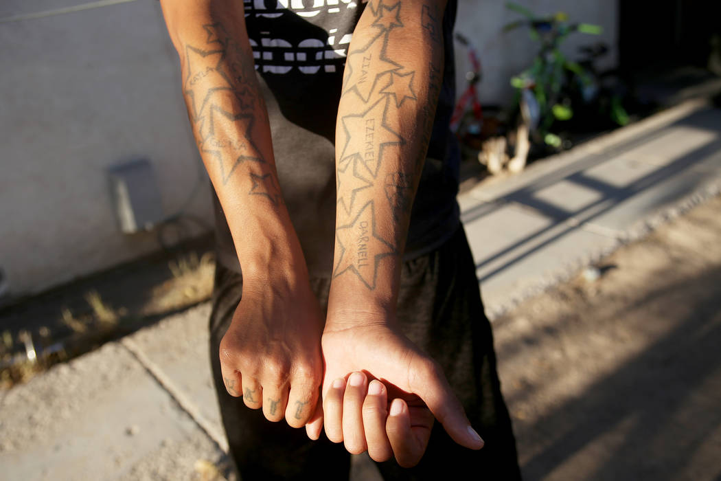 Katrina Graves shows off her tattoos, one for each of her children, outside their home in Las Vegas, Wednesday, Sept. 5, 2018. Rachel Aston Las Vegas Review-Journal @rookie__rae